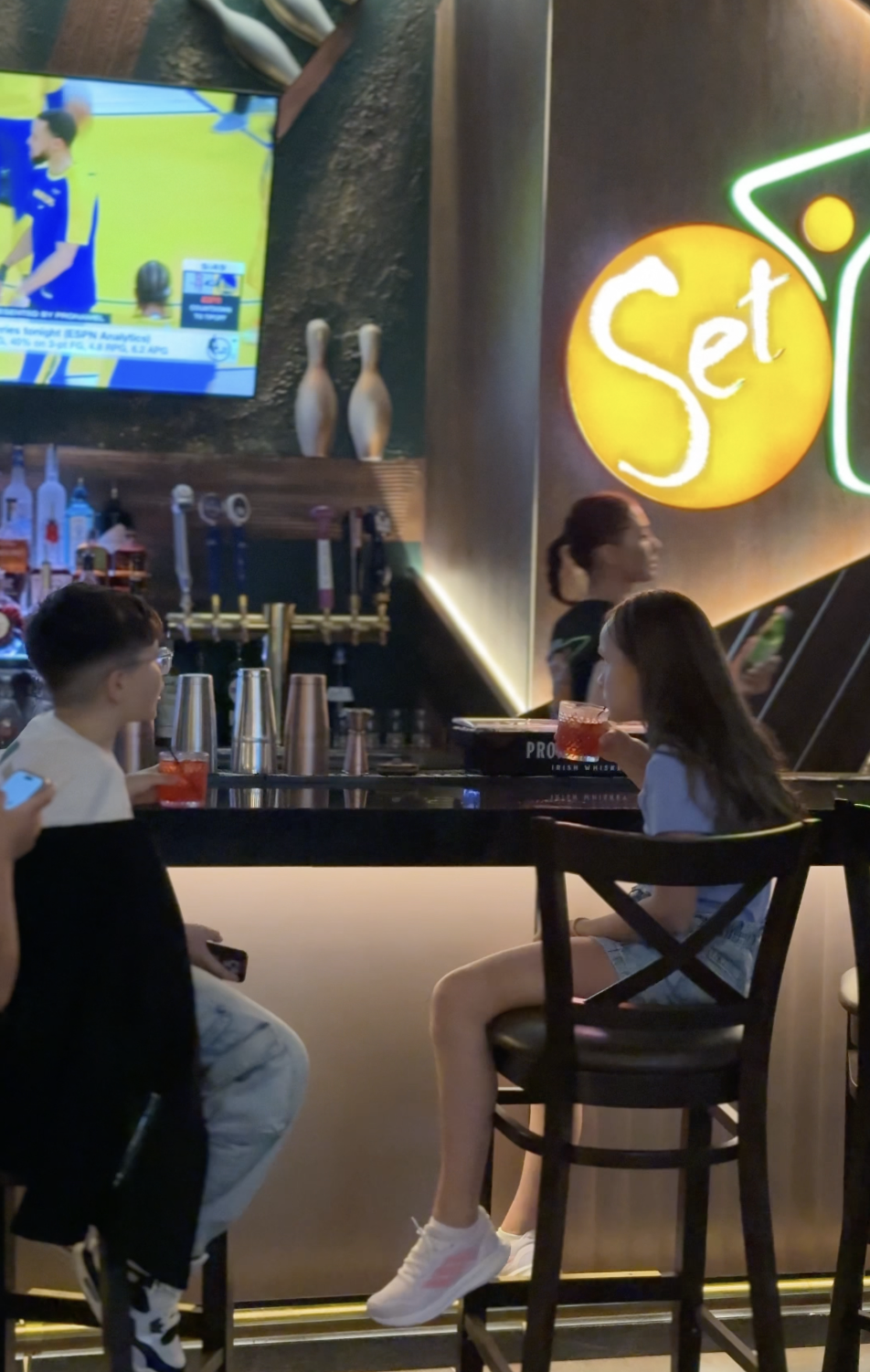 Young guests enjoying drinks at SET